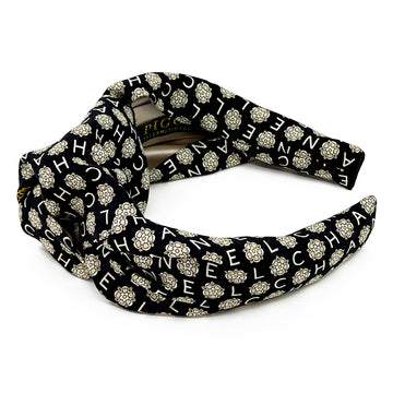 Knot headband made from upcycled chanel camellia scarf