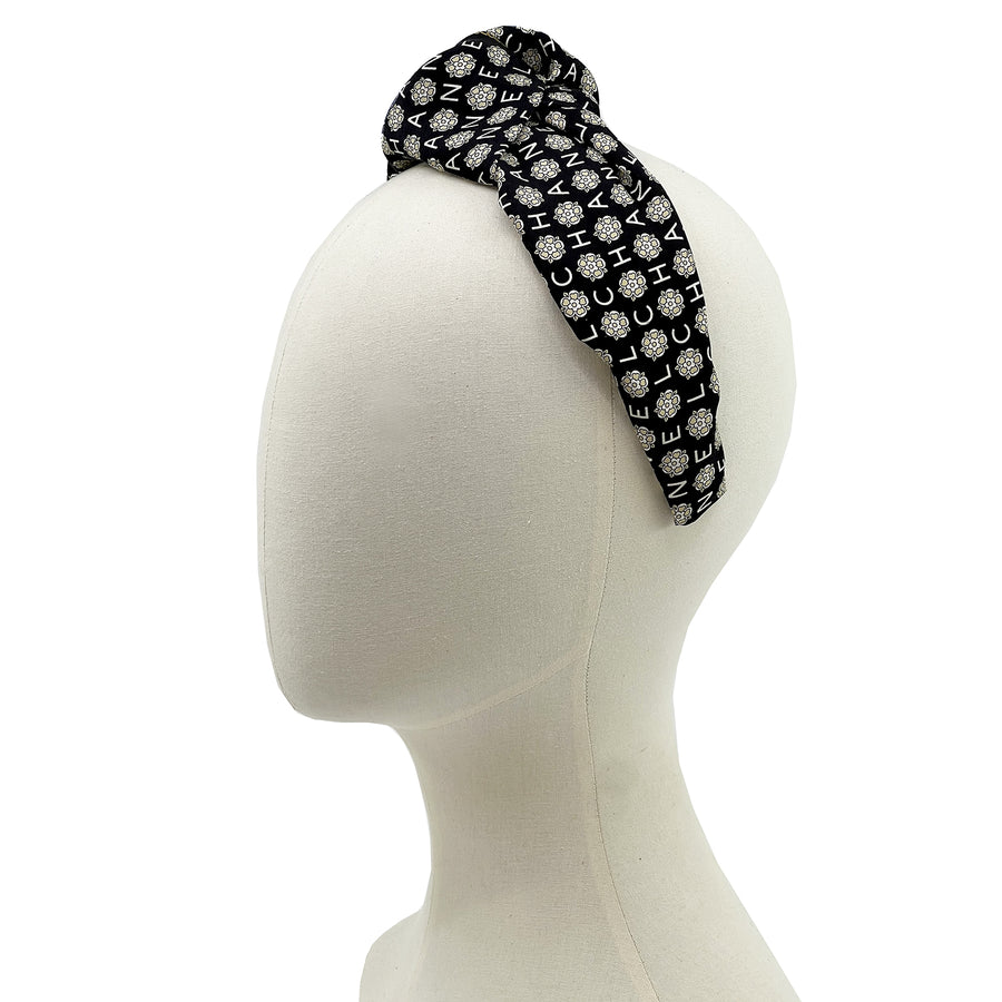 Knot headband made from upcycled chanel camellia scarf