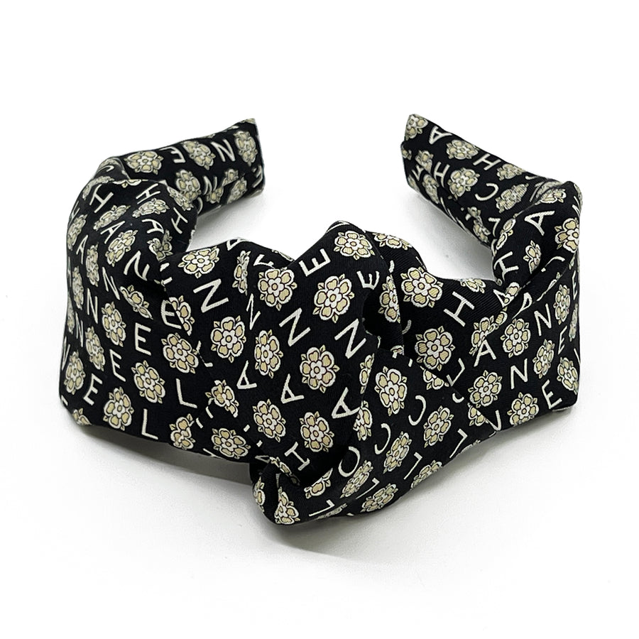 Knot headband made from upcycled chanel camellia scarf