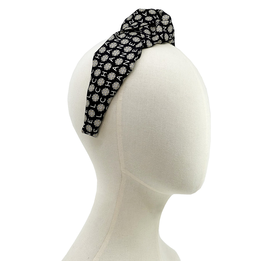 Knot headband made from upcycled chanel camellia scarf